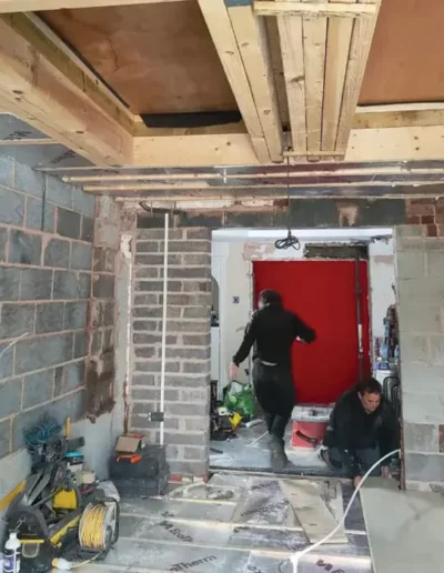 Interior structural work during a home extension in Liverpool showing new blockwork walls and exposed joists