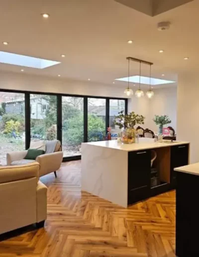 Open-plan kitchen extension in Liverpool with bifold doors, roof skylights and herringbone flooring